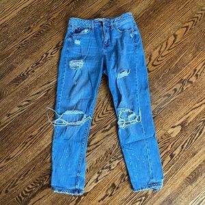 Distressed blue jeans